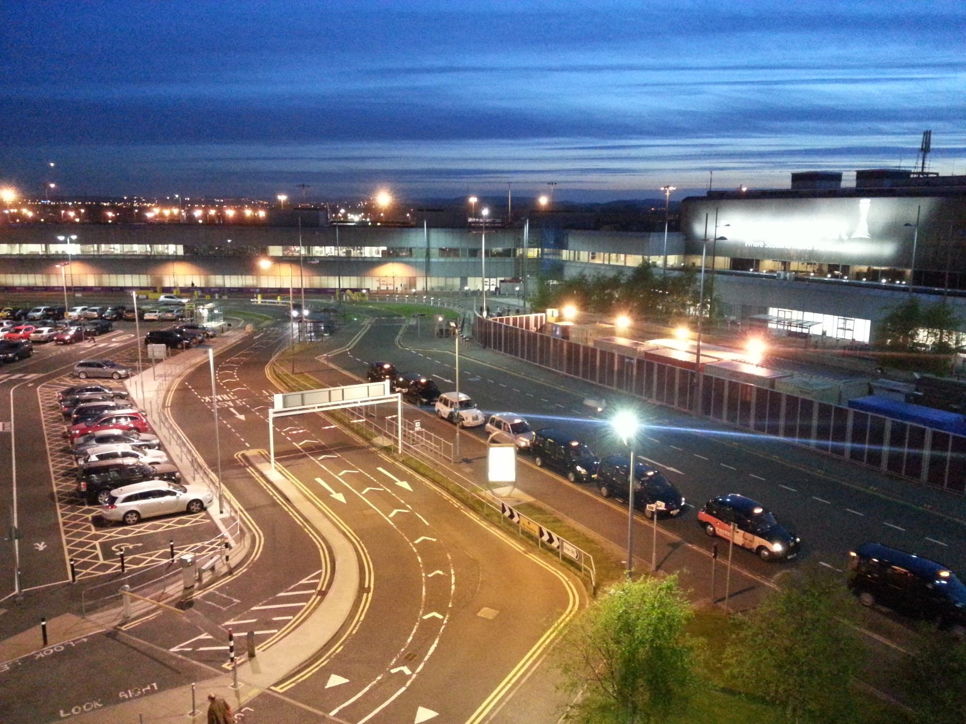 Terminal forecourt and taxi rank at dusk, Edinburgh Airport